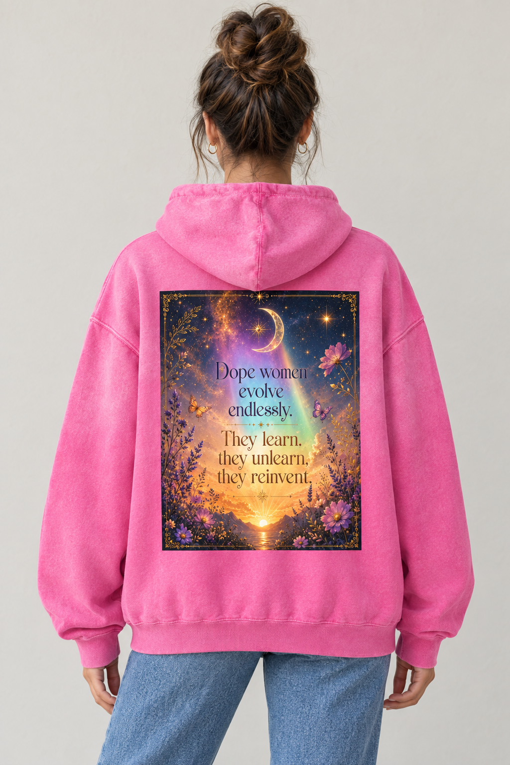 AI-generated back-view mockup of a woman wearing the Pink washed Dope Women Evolve Endlessly hoodie with celestial floral sunset artwork.