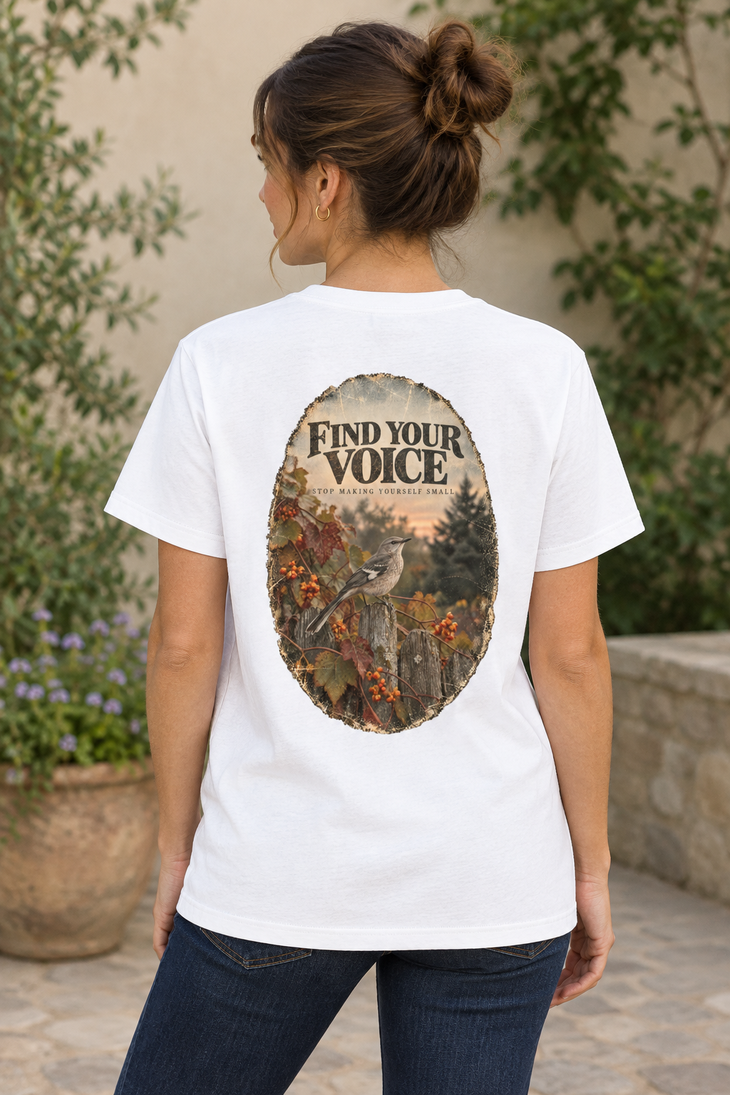 AI-generated mockup of a woman wearing the white Mockingbird graphic T-shirt, viewed from behind with the back artwork visible.