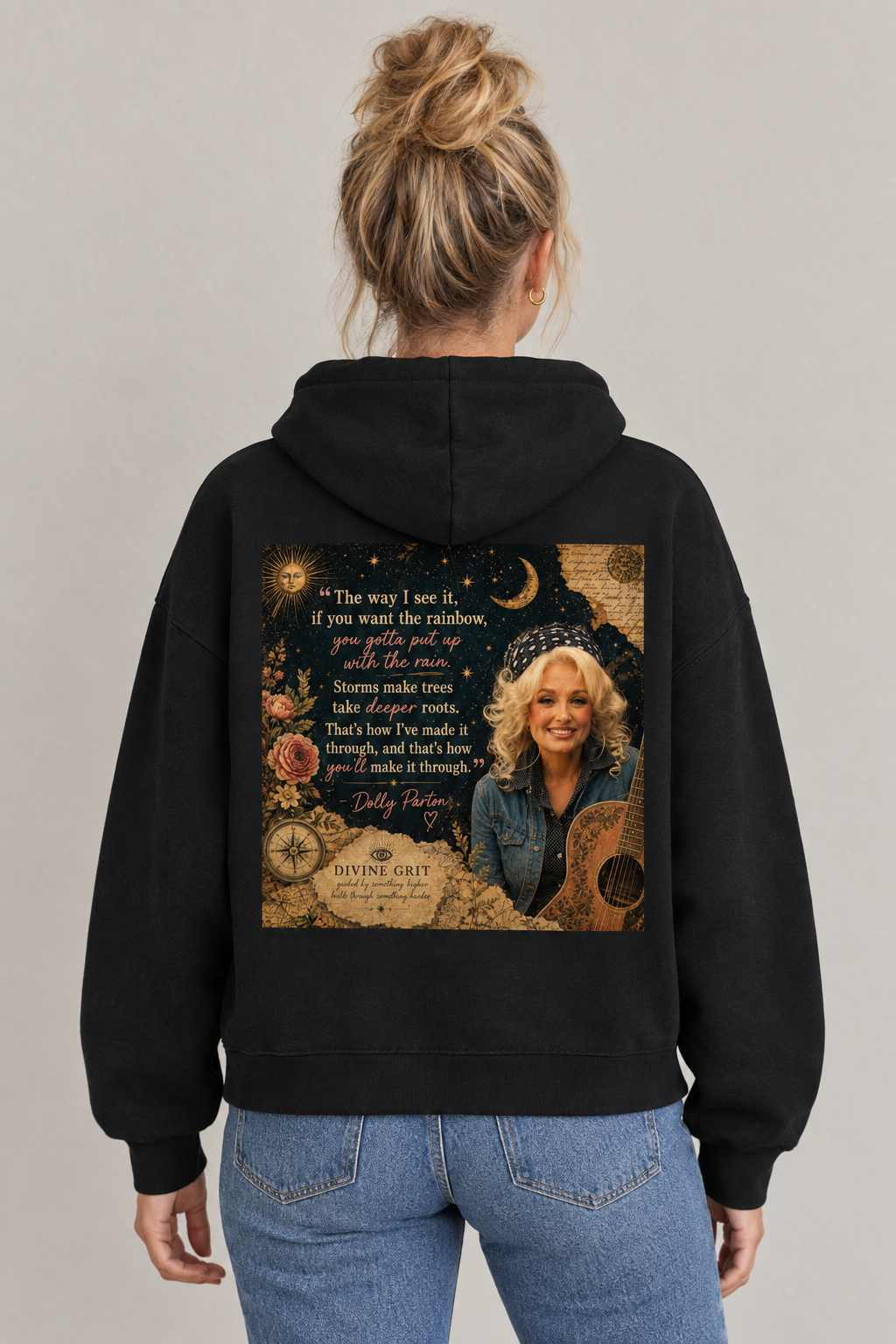 AI-generated back-view mockup of a woman wearing the black Divine Grit hoodie with Dolly Parton portrait and rainbow quote artwork.