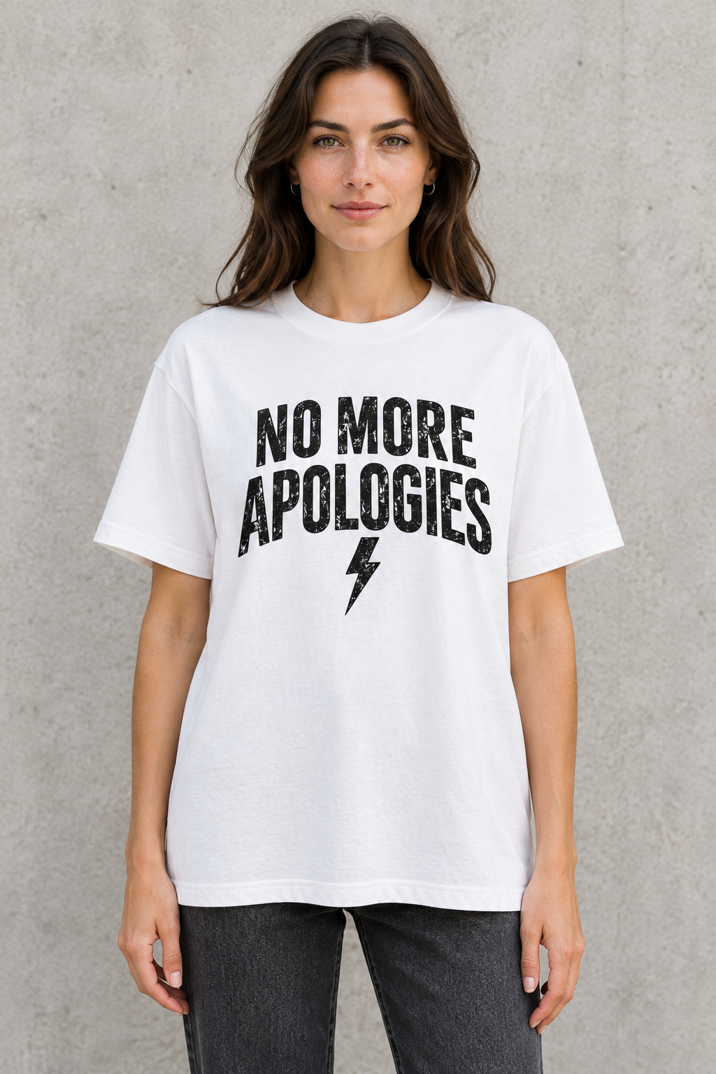 AI-generated mockup of a woman wearing the white loose-fit No More Apologies T-shirt, showing the distressed front lettering and lightning bolt.
