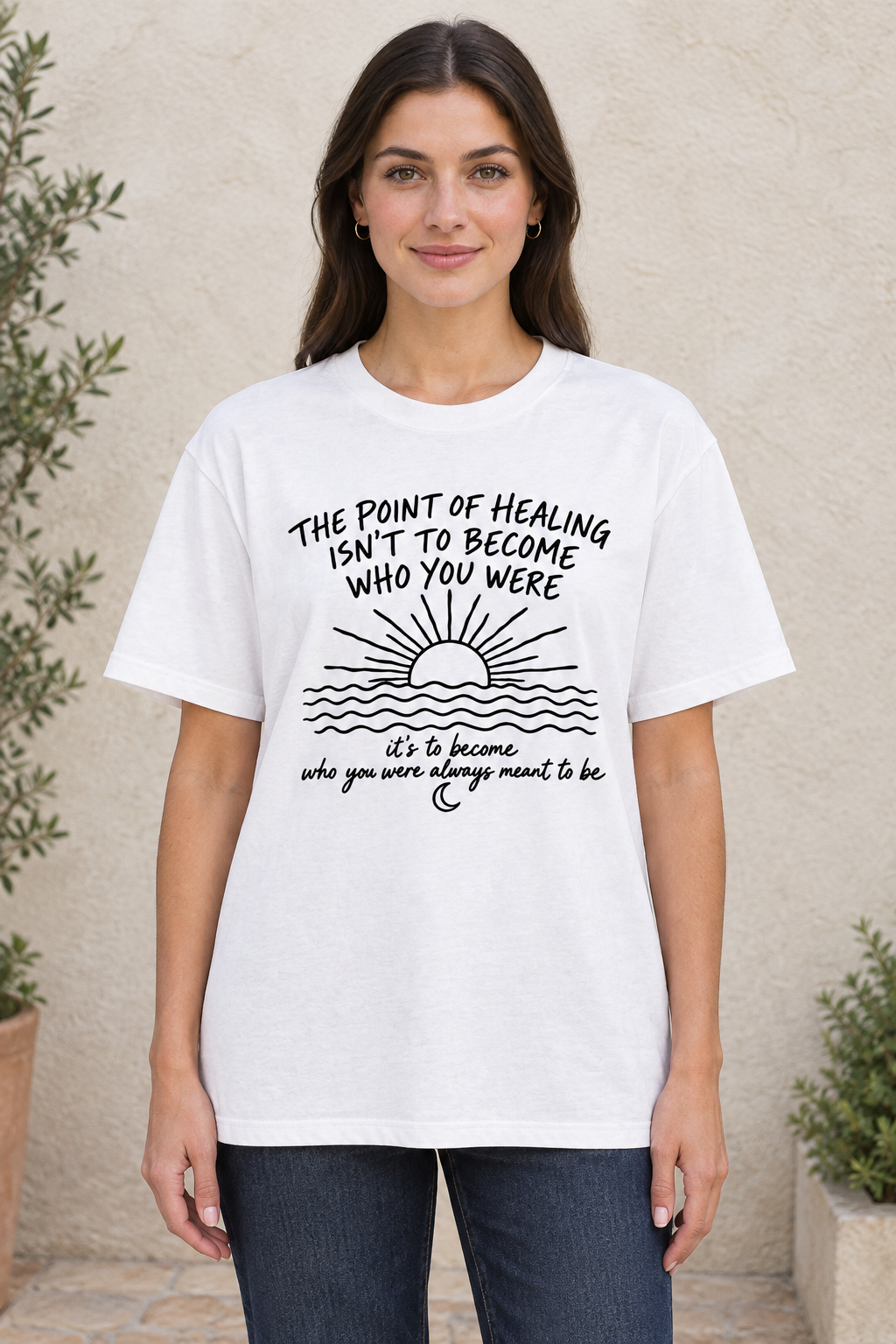 AI-generated mockup of a woman wearing the white Point of Healing graphic T-shirt, showing the healing quote, sunrise, waves, and crescent moon.