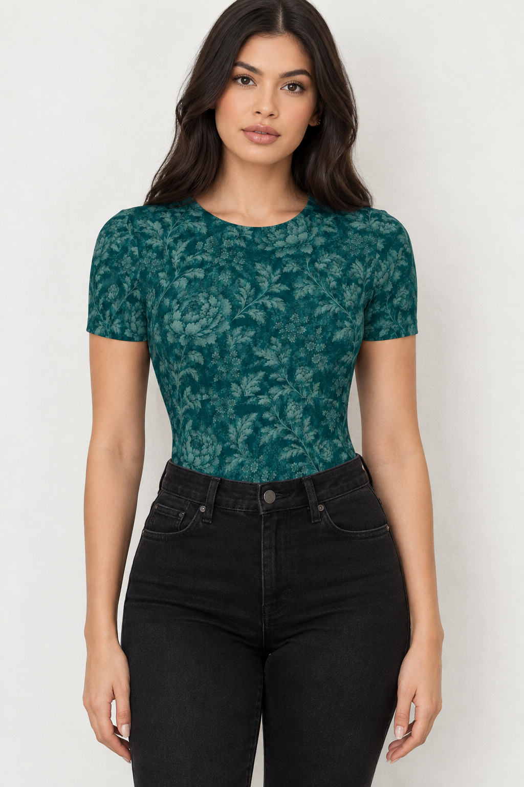 AI-generated mockup of a woman wearing the Midnight Garden teal floral short sleeve bodysuit with high-waisted black jeans.