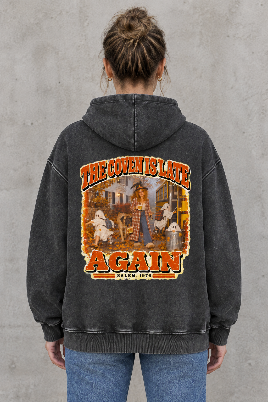 AI-generated mockup of a woman wearing the Black Halloween hoodie, showing The Coven Is Late Again back artwork.