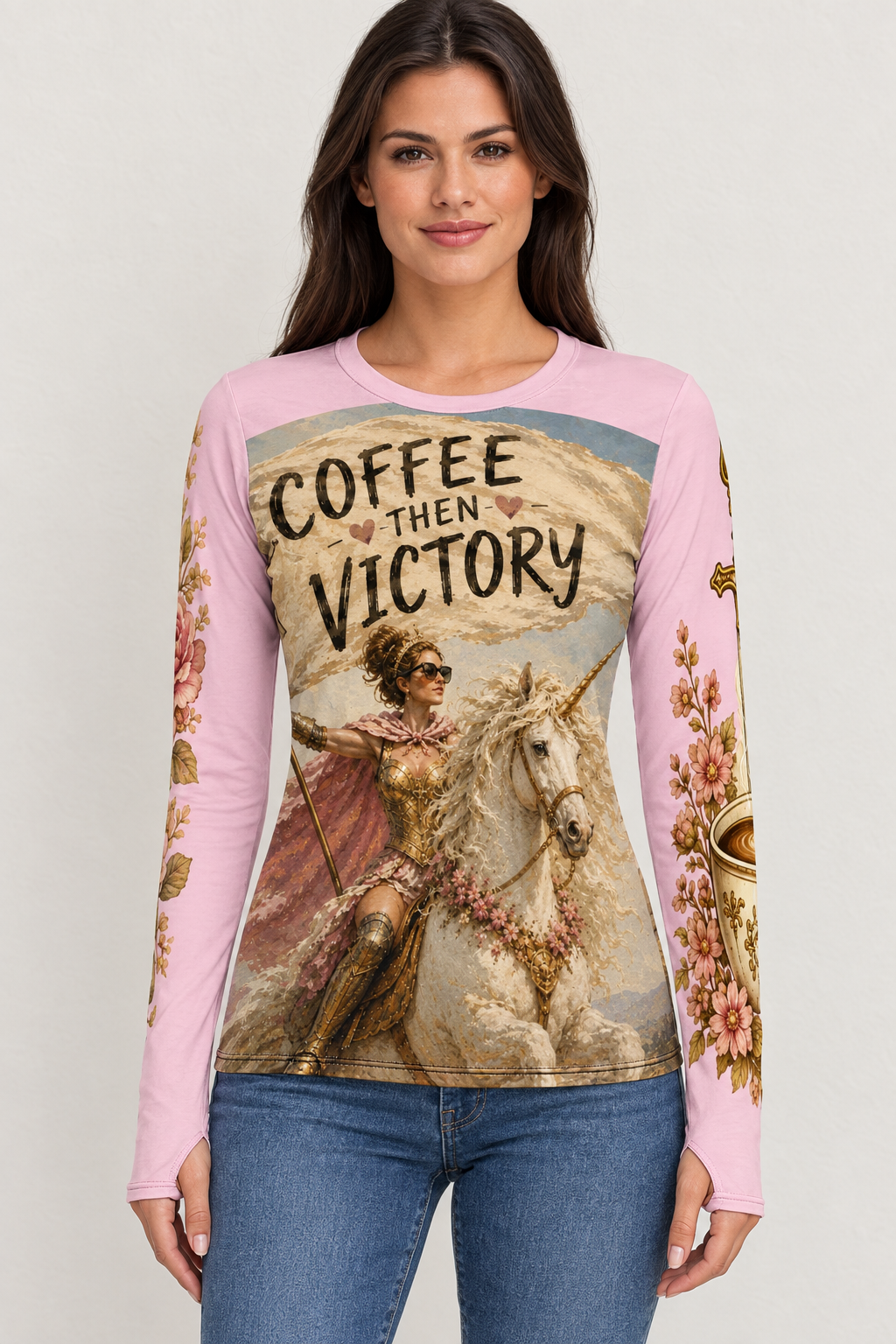 AI-generated mockup of a woman wearing a pink Coffee Then Victory long-sleeve shirt with unicorn artwork, floral coffee-cup sleeves and blue jeans.