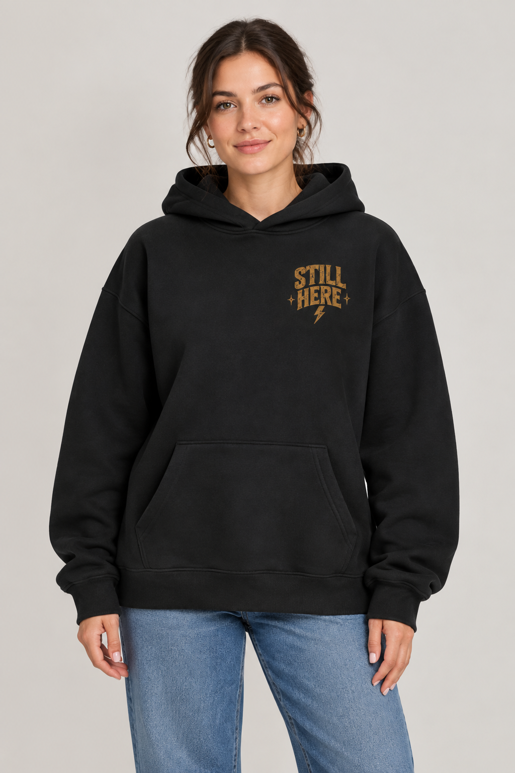 Woman-model front-view mockup of the Still Here hoodie